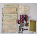 2 WWII medals and miniatures - 1939-45 star and war medal & ration books