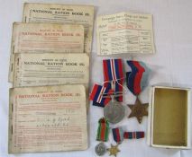 2 WWII medals and miniatures - 1939-45 star and war medal & ration books