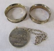 2 silver napkin rings Birmingham 1903 weight 0.32 ozt and a silver vodka spirit label Birmingham