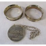 2 silver napkin rings Birmingham 1903 weight 0.32 ozt and a silver vodka spirit label Birmingham