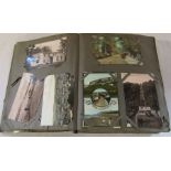 Postcard album containing approximately 450 postcards including UK topographical and Bamforth
