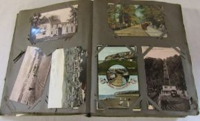 Postcard album containing approximately 450 postcards including UK topographical and Bamforth