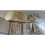 UK and world stamp albums together with bags of loose stamps