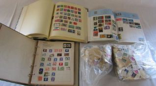 UK and world stamp albums together with bags of loose stamps