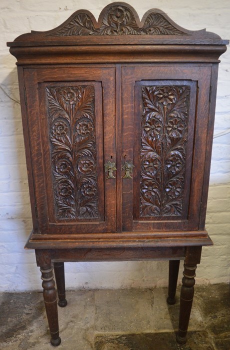 Late 19th century carved oak cabinet on stand Ht 156cm W 80cm D 45cm