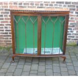 1920s mahogany bow fronted display cabinet (veneer blistering in places) on ball and claw feet
