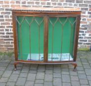 1920s mahogany bow fronted display cabinet (veneer blistering in places) on ball and claw feet