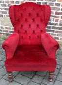 Red wing back armchair on oak legs
