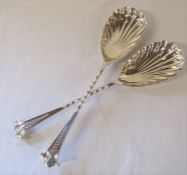 Pair of silver serving spoons with shell shaped bowls and twisted stems, Sheffield 1908 maker