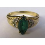 10ct gold ring with marquise emerald stone and diamond chips (marked 10K) size L/M weight 2.6 g