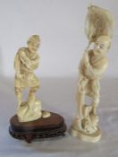 2 Meiji period ivory okimono of a man standing on a rock mounted on a wooden base H 17.5 cm & a