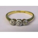 18ct gold diamond trilogy ring, central stone 0.12 ct outer stones 0.08 ct total weight 1.8 g size