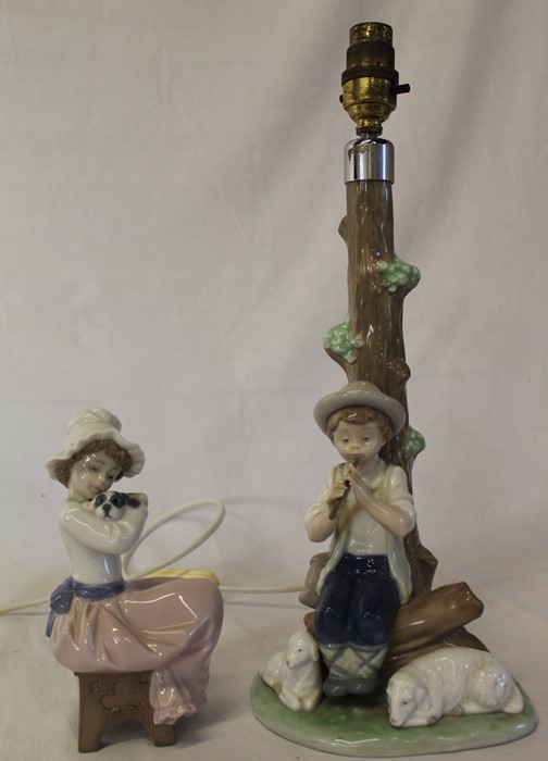 Nao seated girl holding a dog & figural table lamp boy with sheep