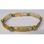 15ct gold gate bracelet with 6 peridots (broken link) total weight 13.8 g L 7.5 "