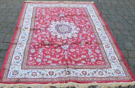 Red ground cashmere carpet with medallion design 2.40m by 1.60m