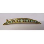 Tested as possibly 15ct gold crescent brooch with seed pearls and opals weight 1.9 g