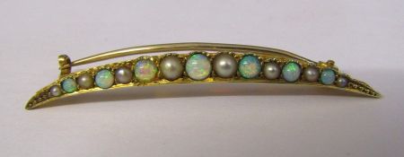 Tested as possibly 15ct gold crescent brooch with seed pearls and opals weight 1.9 g