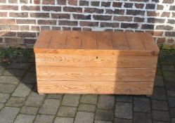 Pitch pine blanket box containing pillows and material