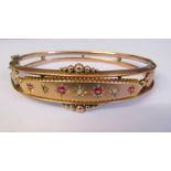 Edwardian 9ct gold hinged bracelet / bangle with diamond and red stone accents and safety chain