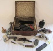 Small vintage suitcase containing various items inc toy pistols - Hubley Police .38 Dandy and