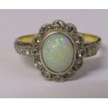 18ct gold and platinum ring with central opal and diamond chips (diamond total 0.25 ct) total weight