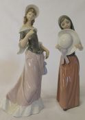 2 Lladro figurines - lady holding hat and one other (missing parasol?)
