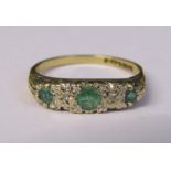 9ct gold emerald and diamond accent ring size M weight 1.7 g