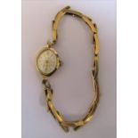 9ct gold ladies Accurist 21 jewel wrist watch with 9ct gold elasticated strap, weight excluding