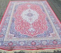 Red ground traditional floral pattern cashmere carpet 3.03m by 1.98m