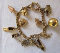 9ct gold charm bracelet with 9ct gold and yellow metal charms total weight 26.5 g