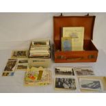 Large collection of old postcards in a small vintage carrying case