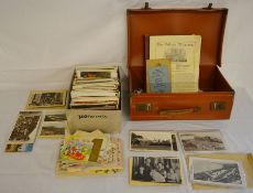 Large collection of old postcards in a small vintage carrying case