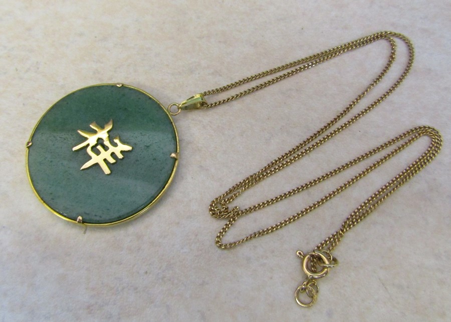 9ct gold necklace weight 1.8 g with 14K jade style Oriental pendant (weight 8.6 g)