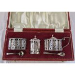 Cased silver condiment set with blue glass linings, weight approximately 7.6 ozt (pepper pot glass