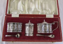 Cased silver condiment set with blue glass linings, weight approximately 7.6 ozt (pepper pot glass
