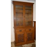 Victorian oak display bookcase with carved panel lower doors Ht 223cm W 113cm D 47cm