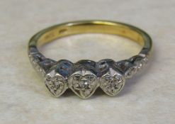 18ct gold heart shaped ring with diamond accents size L/M weight 3.6 g