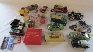 Assorted puzzle games and die cast cars