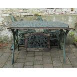 Cast iron table with matching bench and chair back panels, bench ends and chair ends