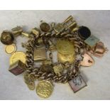 9ct gold charm bracelet with 26 9ct gold charms inc TV set, stork, bible, fob 1919, cufflinks,