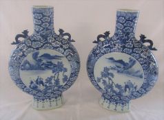 Pair of late 19th/early 20th century blue and white Chinese moon flask vases H 39 cm. Repair to