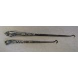 2 silver handled boot hooks inc one in the shape of a panther (hallmarks indistiguishable)