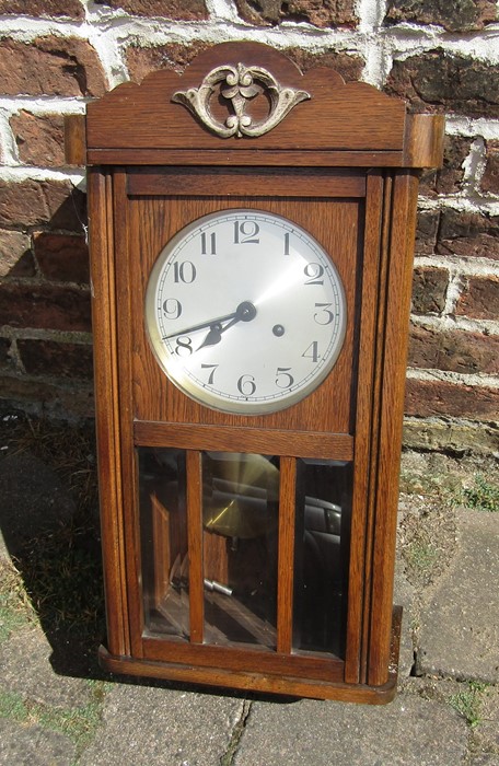 Oak cased wall clock with pendulum and key