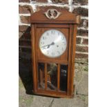 Oak cased wall clock with pendulum and key