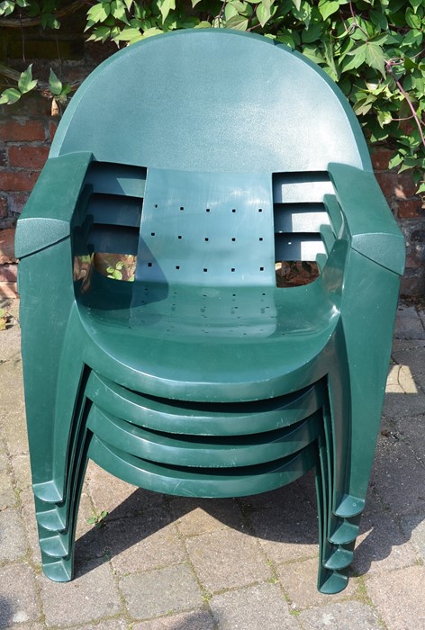4 green plastic stacking garden chairs