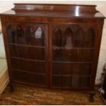 Early 20th century bow fronted mahogany display cabinet on ball & claw feet H 126cm L 122cm