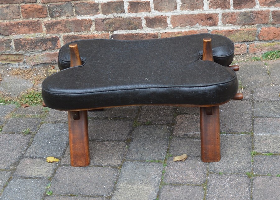 Camel saddle stool