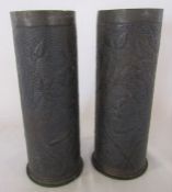 Pair of trench art shell cases with floral embossed decoration H 22.5 cm