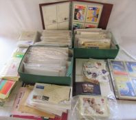 Large quantity of FDCs and postcards together with loose unused stamps etc