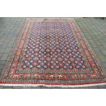 Red ground Persian rug 300 cm x 199 cm